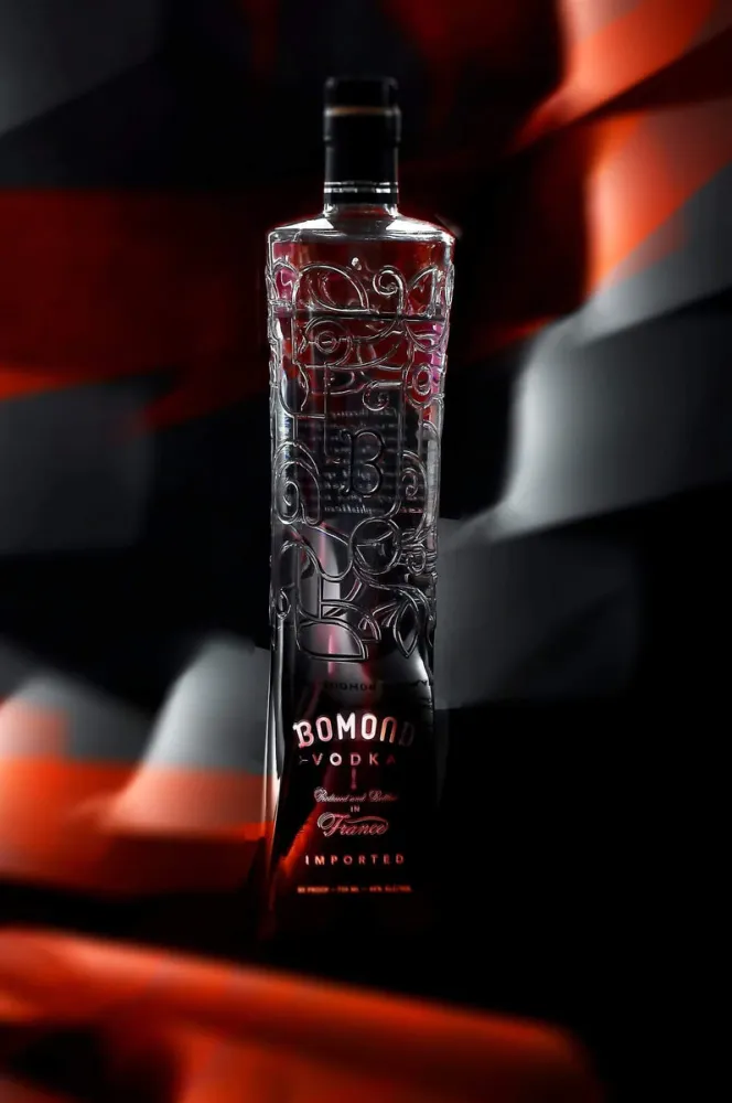 Bomond Vodka bottle photographed in a dramatic red and black studio setting